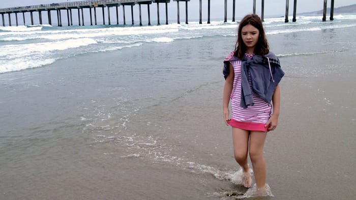 Andrea walking on La Jolla Shores on an overcast morning